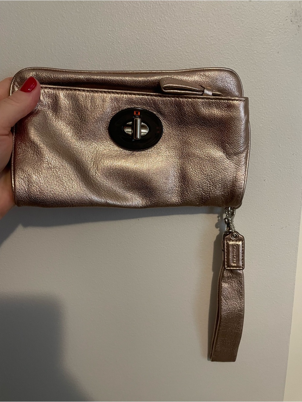 Coach Metallic Rose Gold Turnlock Wristlet